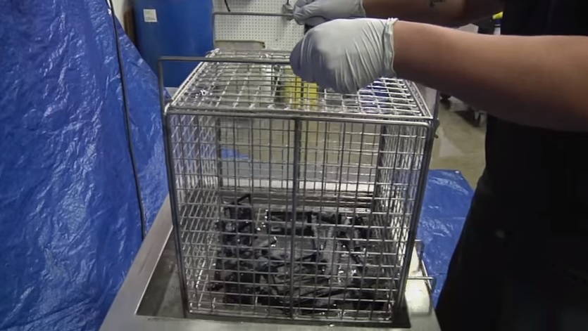 3D printed parts plunged into an ultrasonic cleaning bath. Screenshot via Omegasonics on YouTube