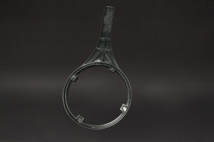 black and white photo of a pair of scissors next to an industrial ultrasonic cleaner and a Filter Wrench